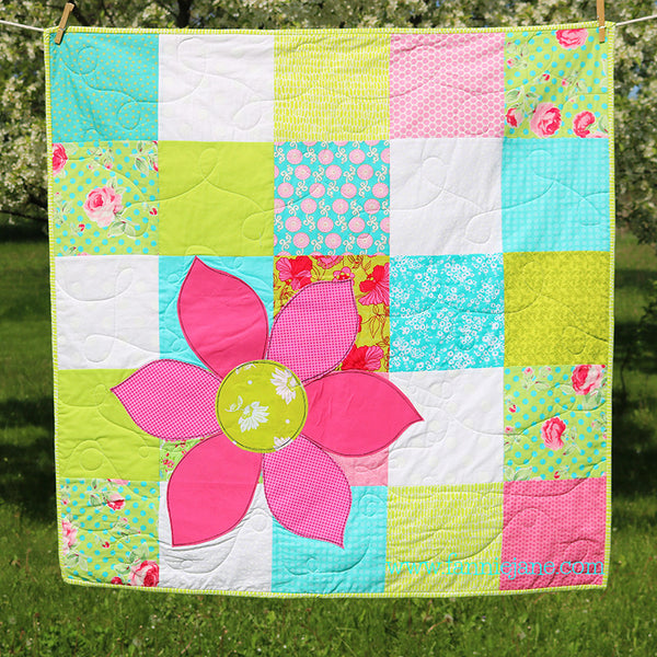 handmade flower on patchwork quilt